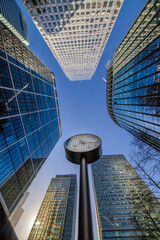 Canary Wharf Clocks against glass and steel buildings