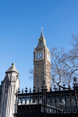 Fototapeta na wymiar Close up of Big Ben against a blue sky in warm sunshine