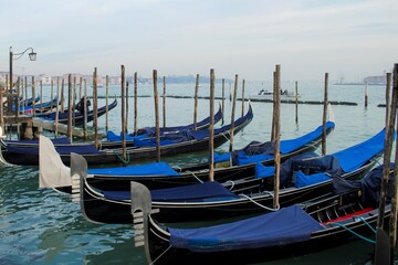 Gondolas traditional boats in Venice on the promenade of the Grand Canal