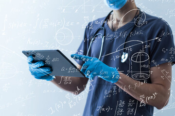 Quantitative analyst is drawing different math formulas on the glass screen.