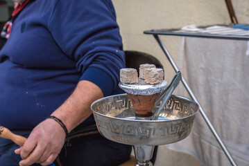 Man smoking shisha in Sin el Fil suburb east of Beirut, Lebanon