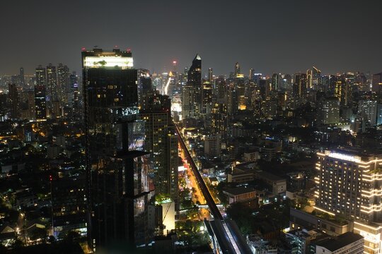 Spectacular view over the city lights of Bankok in Thailand at night photographed from a rooftop bar.