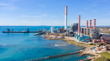Aerial view on a large thermal power plant built along the coasts of the Mediterranean sea in...