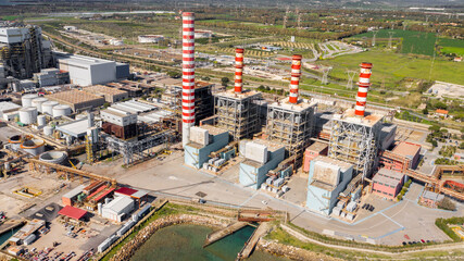 Aerial view on a large thermal power plant built along the coasts of the Mediterranean sea in...