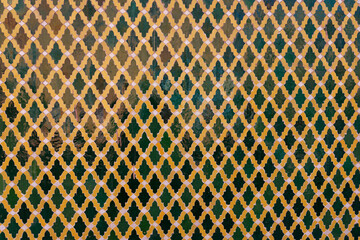 Moroccan mosaic, detail shot of a old Moroccan mosaic in green and orange.