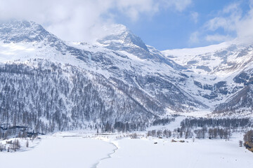 Fototapeta na wymiar Canton Graubunden, Switzerland : Landscape in Alp Grum train station (Bernina express) during winter season