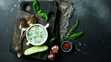 Okroshka cold vegetable soup in a white bowl. Free space for text. Close up.