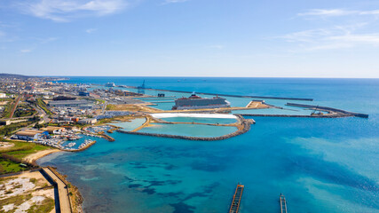 Aerial view of the port of Civitavecchia, near Rome, Italy. There are large cruise ships and ferries ready to go.