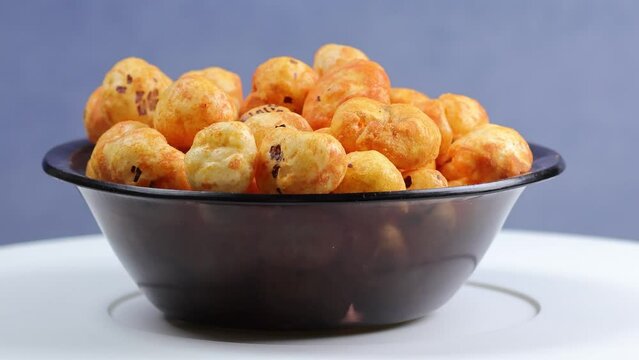 Rotating shot of Prickly Water Lily. Dried makhana also known as water lily. Fox nut. Makhanas. Lotus seeds.The edible seeds, called fox nuts or makhana when dried, are eaten in Asia. 4k 50 fps.