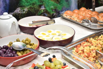 Buffet breakfast bread, egg, rice, coffee, yogurt, milk, cereals, meat, chicken