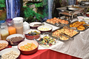 Buffet breakfast bread, egg, rice, coffee, yogurt, milk, cereals, meat, chicken