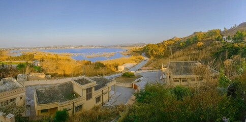 Obraz premium Kallar Kahar Lake, Chakwal District, Punjab, Pakistan - December, 25, 2018: Famous for salt water Lake and beautiful species of birds, its a charming place with good air.