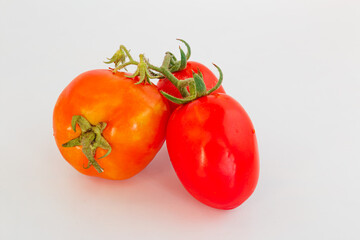 red ripe tomatoes on a white background