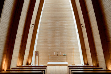 interior of a church in the light of the sun with wooden walls in Turku, Finland