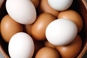 Top view chicken eggs and white duck eggs ready for breakfast