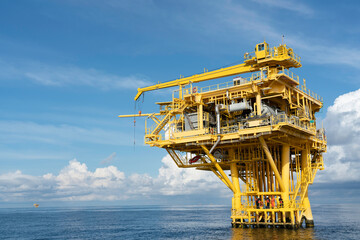 Fototapeta premium Offshore oil and gas wellhead remote platform which produced raw material for sent to onshore refinery, power generation and petrochemical industry. 