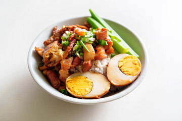 Braised meat rice, close up of stewed pork over cooked rice, egg and lady finger. Taiwanese traditional cuisine food.