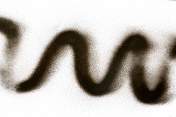 wavy line of black spray paint on white paper background
