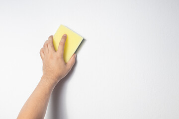 hand holding a sponge with a bubble