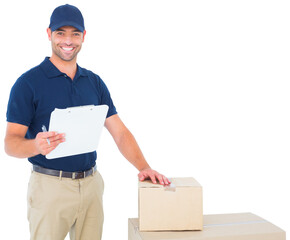 Happy delivery man with cardboard boxes and clipboard