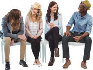 Smiling business people sitting on chair 