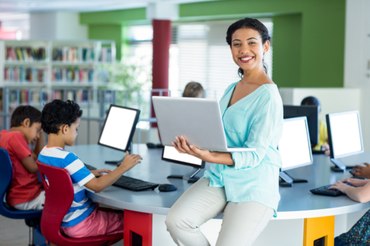 Teacher holding laptop