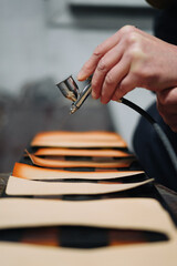 Small business manufacturing wallets from leather