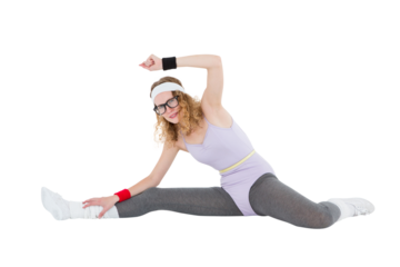 Geeky hipster stretching her legs on the floor