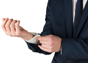 Businessman adjusting his cuffs on shirt