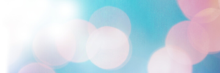Defocused image of pink sunbeam against blue sky