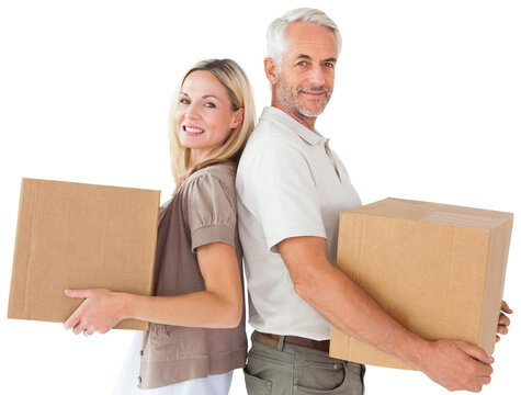 Portrait of couple standing with cardboard box