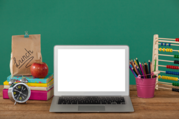 School supplies with laptop on wooden table