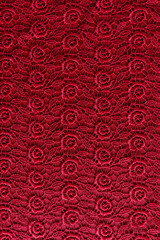 chic burgundy background of vintage lace. vertical view. background for design, decor.