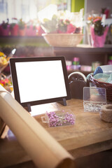 Digital tablet on table with straight pin box