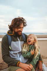 Family father with child outdoor dad with daughter happy laughing face vacations lifestyle together candid emotions - 587341966