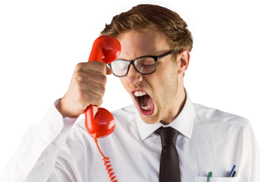 Angry geeky businessman holding telephone