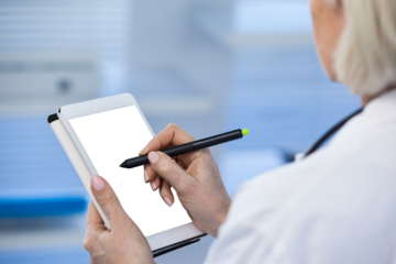 Doctor using digital tablet