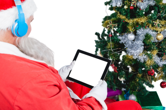 Santa Claus listening music and using digital tablet  - Powered by Adobe