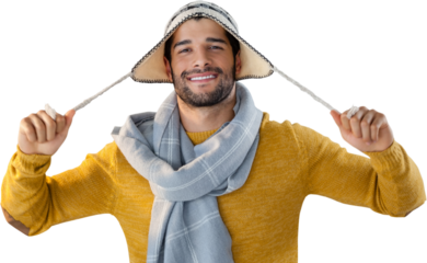 Portrait of smiling man holding wooly hat