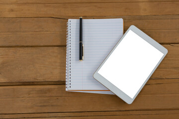 Blank notepad and digital tablet on wooden plank