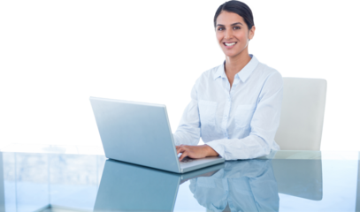 Smiling businesswoman working with her laptop