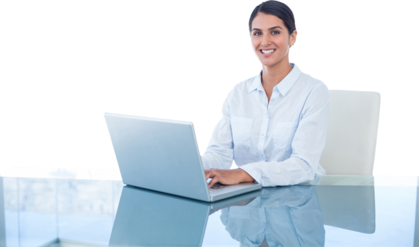 Smiling businesswoman working with her laptop 