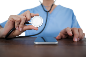 Midsection of female doctor examining mobile phone with stethoscope