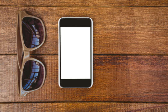 View of glasses and a smartphone