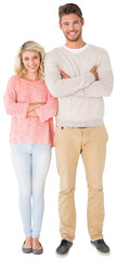 Attractive couple smiling with arms crossed