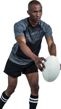 Confident rugby player in position of throwing ball
