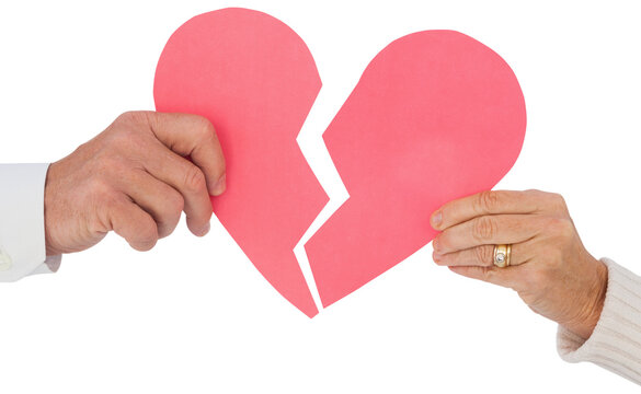 Couple holding a broken paper heart