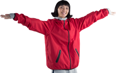 Smiling woman standing with arms outstretched