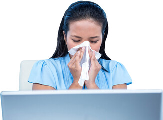 Businesswoman blowing her nose