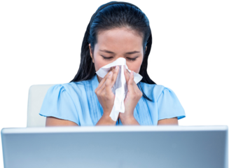 Businesswoman blowing her nose